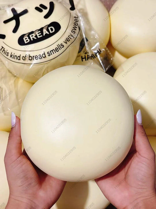 Giant milk bun squishy — soft white slow-rise bun